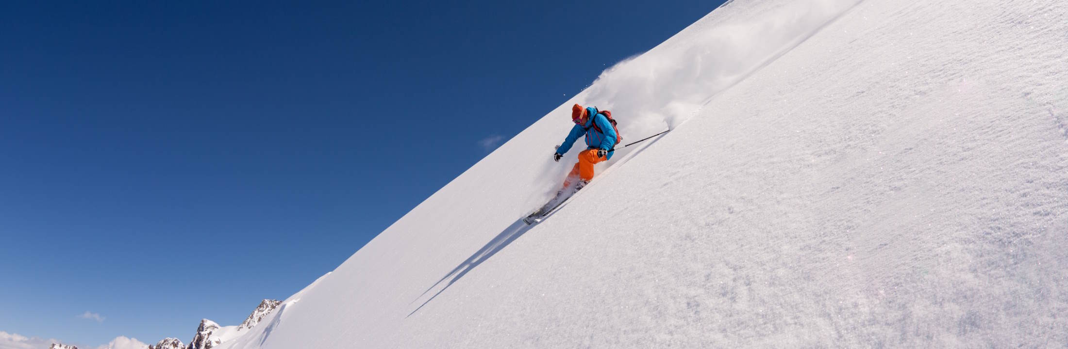 A skier on a steep slope as a metaphor for cost reduction